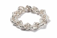 The close-up view of a multi-link bracelet with a slightly dull silver sheen, resting on a white background.