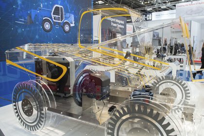 Transparent vehicle model shows internal technology and drive systems.
