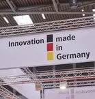 Sign on traverse: ‘Innovation made in Germany’ with the colours of the German flag at transport logistic.