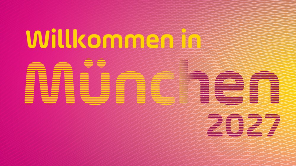  Rosa-orangefarbenes Plakat für die DMEA 2027 in München, 13.-15. April, mit dem Text Willkommen in München 2027.