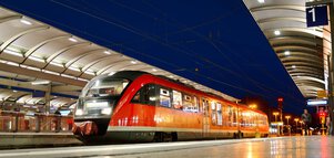 Train in railway station at night