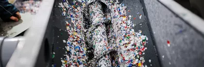 Small, colorful plastic parts are processed further.
