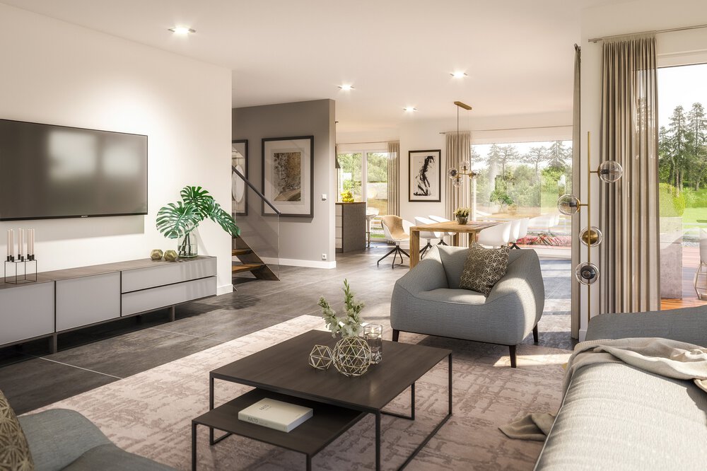 Modernes Wohnzimmer mit grauem Sofa, Fernseher und Couchtisch; offener Grundriss zum Essbereich und große Fenster mit Blick ins Grüne.