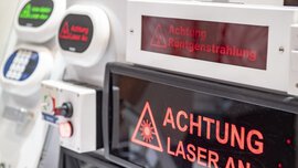 Several illuminated warning signs and emergency switches with texts such as 