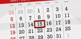 Calendar page with one month, with the 15th date highlighted in red.