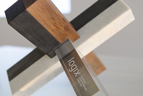 Close-up of the logix—German Logistics Property Award 2015. An award made up of square rods of different materials fitted together.