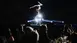 An acrobat performs a handstand on a disco ball at the INHORGENTA AWARD gala, captivating the seated audience.