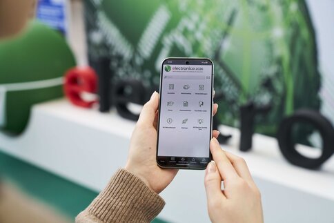 Hand holds a smartphone 