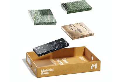 Fünf Steinmaterialproben schweben über einem Karton mit dem Text „Material Bank“.