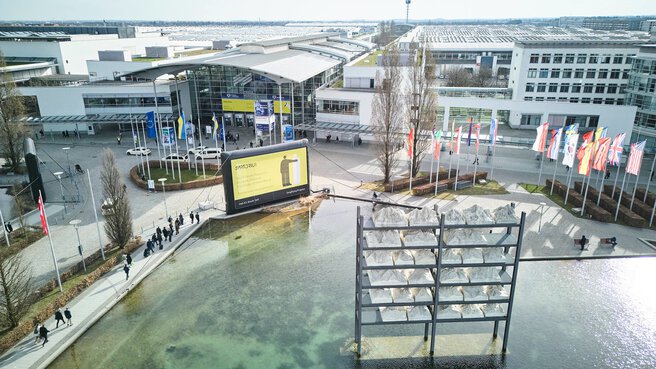 Aerial view of the exhibition grounds and entrance area.