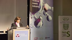 of a person standing behind a lectern