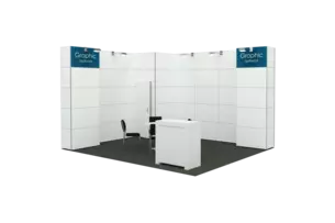 Exhibition stand with white walls, a black chair, a table and a counter.