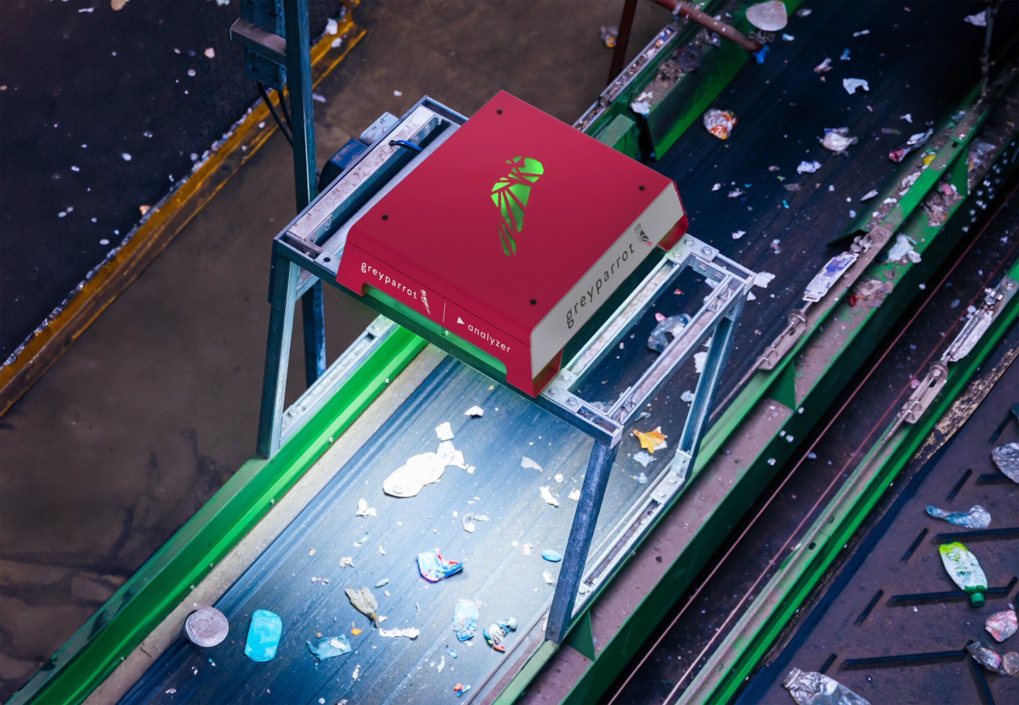 An analytical device from Greyparrot above a conveyor belt in a recycling plant.