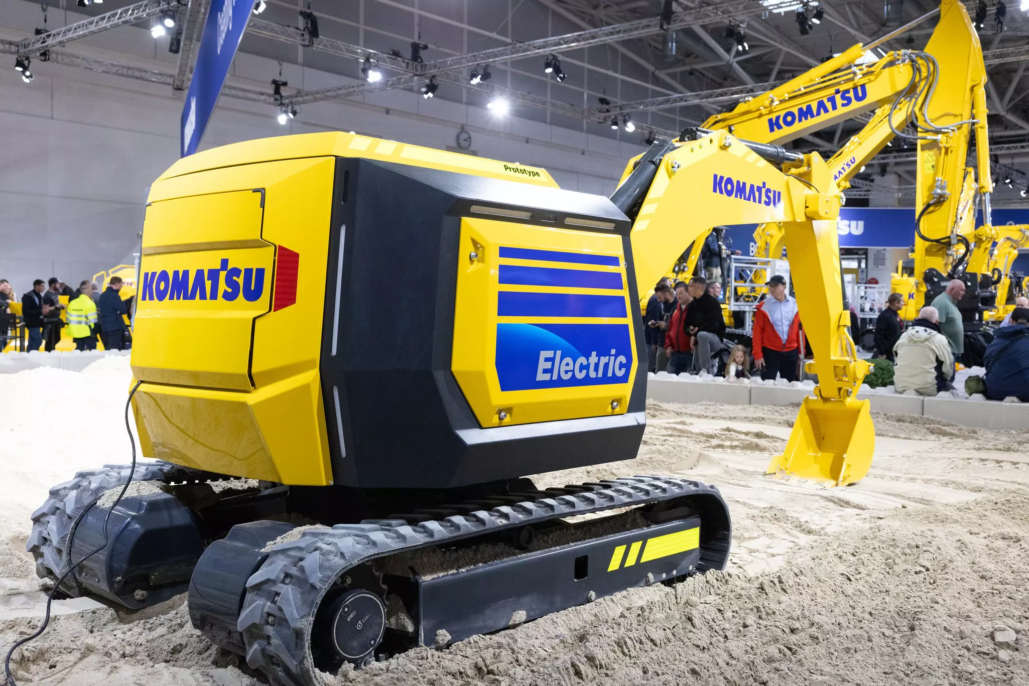 Live demonstration of a Komatsu mini driverless electric excavator at the Komatsu stand at bauma 2022