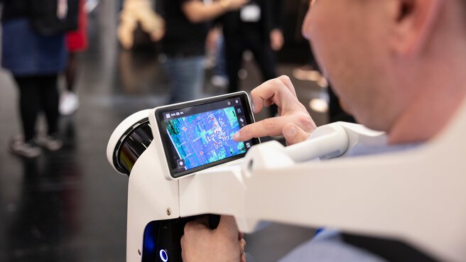 Man wears an exoskeleton with a touchscreen