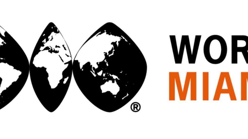 The logo of the WORLD TRADE CENTER MIAMI in black and orange lettering with a globe divided into three parts next to it.