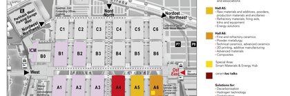 Hallenplan der Messe München mit farbkodierten Ausstellungshallen und einer Legende, die die verschiedenen Bereiche und Einrichtungen angibt.