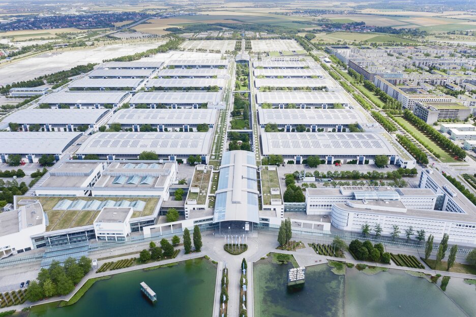 Aerial view of the Messe München grounds and the lake.