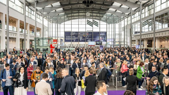 Large crowd in the exhibition hall entrance