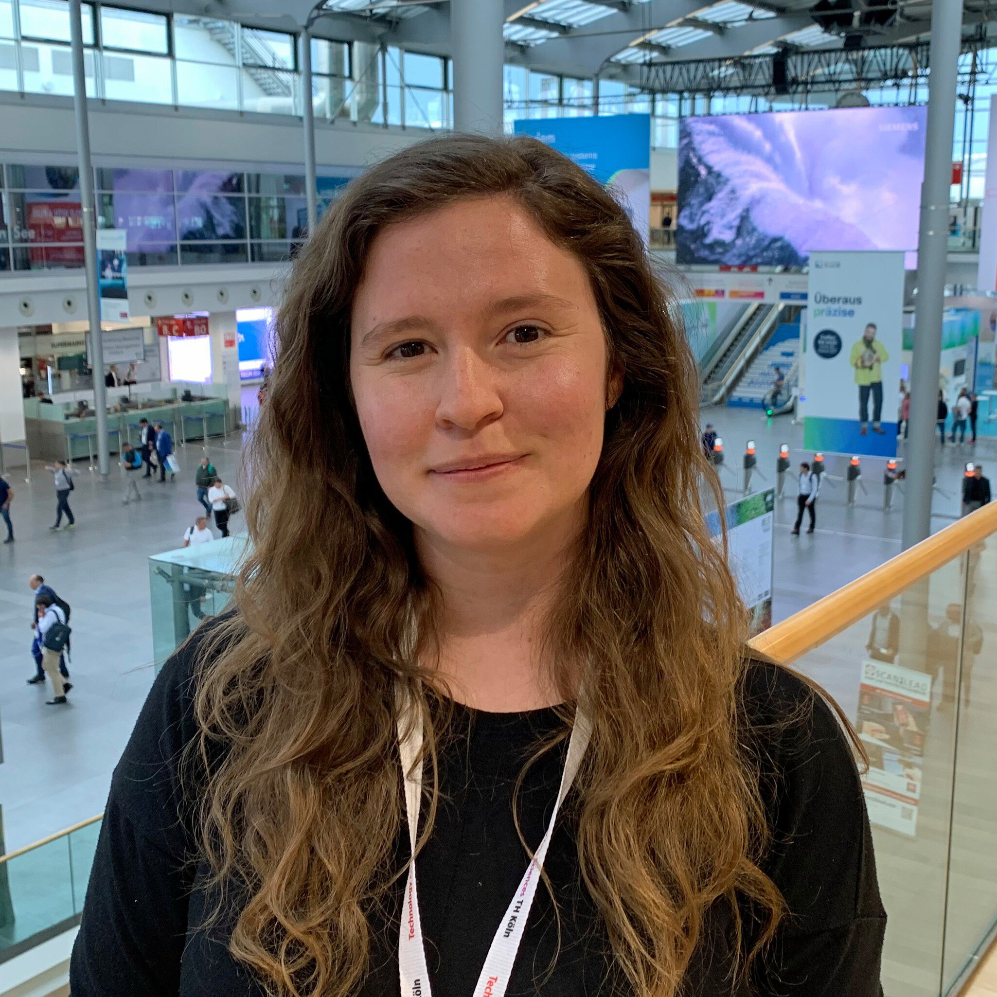 Student Cassie Tragert conducting her AI research at IFAT Munich