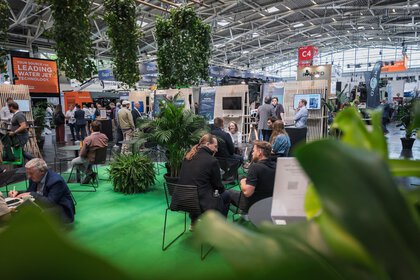 Wide view of the IFAT Munich Startup Area with visitors and startup booths.