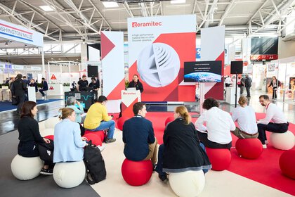 Presentation on the ceramitec stage with a seated audience in the exhibition hall.