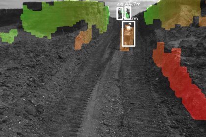 Camera image of a field path with coloured markings and labelled boxes for displaying measured distances.