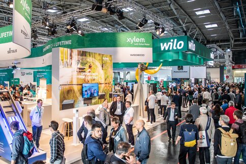 Visitors stream around the exhibition stands at IFAT Munich in Hall C2.