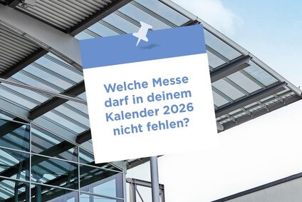 Auf dem Foto ist schwarze Schrift mit Messejahr München​ 2026 zu sehen auf einem weißen Hintergrund außerdem sieht man ein großes Glasdach im Hintergrund