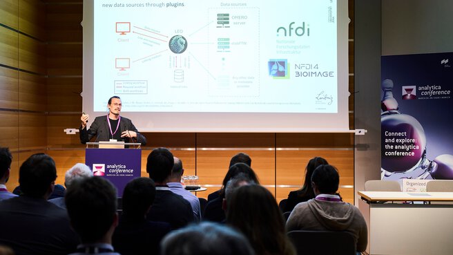 Presentation on the analytica conference stage in front of an audience