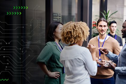 Group of people chatting during networking break at business conference