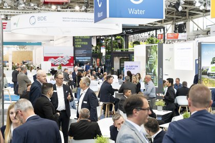 An exhibition hall with well-attended exhibition stands during IFAT.