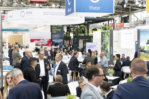 An exhibition hall with well-attended exhibition stands during IFAT.
