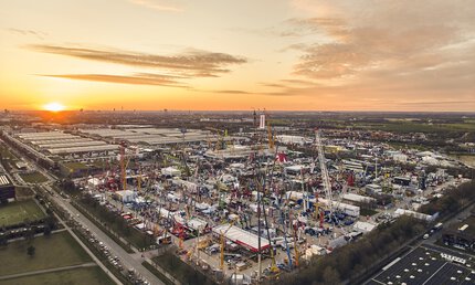 Sunset over bauma and the Messe München exhibition grounds.