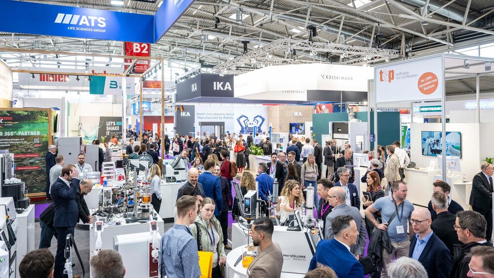 A packed exhibition hall featuring laboratory solutions, technology, and expert discussions.
