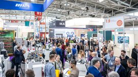 A packed exhibition hall featuring laboratory solutions, technology, and expert discussions.