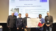 Handing over a giant cheque to Anish Das on the stage of the Eberhard Gerstel Award 2024
