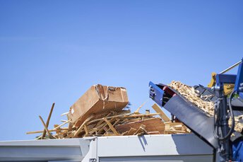 Machine for processing waste wood