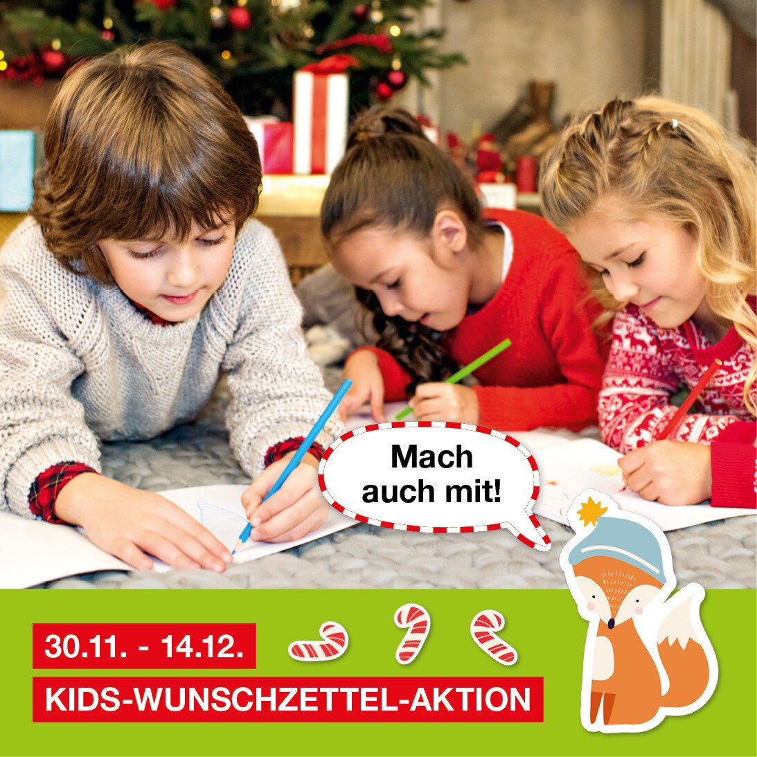 Drei Kinder liegen auf einem Teppich unter einem Weihnachtsbaum und malen auf Papier. Darunter steht die Ankündigung „30.11.–14.12. KIDS-WUNSCHZETTEL-AKTION“.