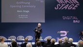 Opening ceremony of digitalBAU, stage featuring the digitalBAU logo and host Boris Schade-Bünsow—editor-in-chief of Bauwelt, Bauverlag