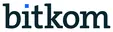 The image shows the word ‘bitkom’ in a black serif font with a small blue square above the letter ‘i’.