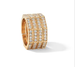 A wide gold ring in the shape of a honeycomb, divided into four equal sections and set with numerous diamonds.