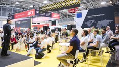 Speaker and audience at the special show Photonics Meets Robotics