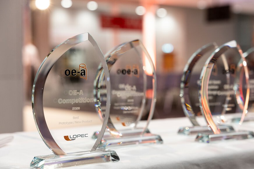 Glass trophies of the OE-A Competition 2026 on a table