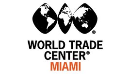 The logo of the WORLD TRADE CENTER MIAMI in black and orange lettering with a globe divided into three parts above it.