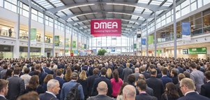 Large crowd of attendees in the DMEA entrance hall beneath a “Connecting Digital Health” banner