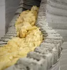 Close-up of insulation material inside a 3D-printed concrete structure.