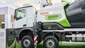 CIFA concrete mixer lorry parked on green ground in the outdoor exhibition area.
