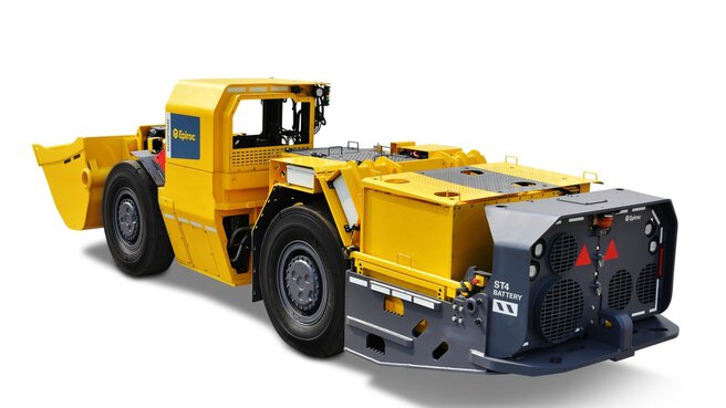 Ein gelb-grauer Untertage-LKW für schwere Aufgaben, mit gut sichtbarem Branding an Seite und Heck.