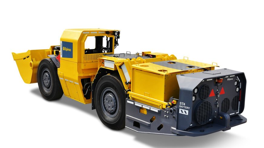 A yellow-grey underground truck for heavy-duty tasks, with clearly visible branding on the side and rear.